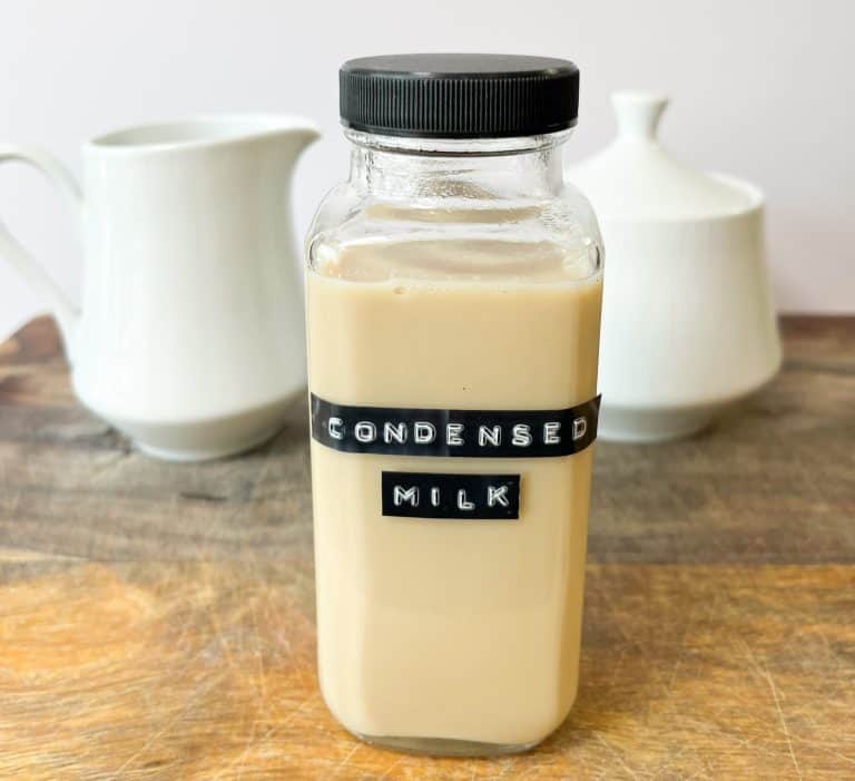 homemade sweetened condensed milk in a glass bottle