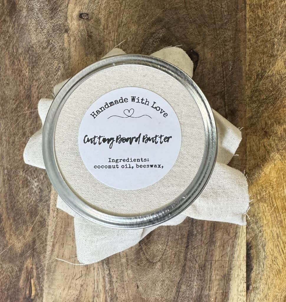 wood cutting board butter sitting on a wooden cutting board