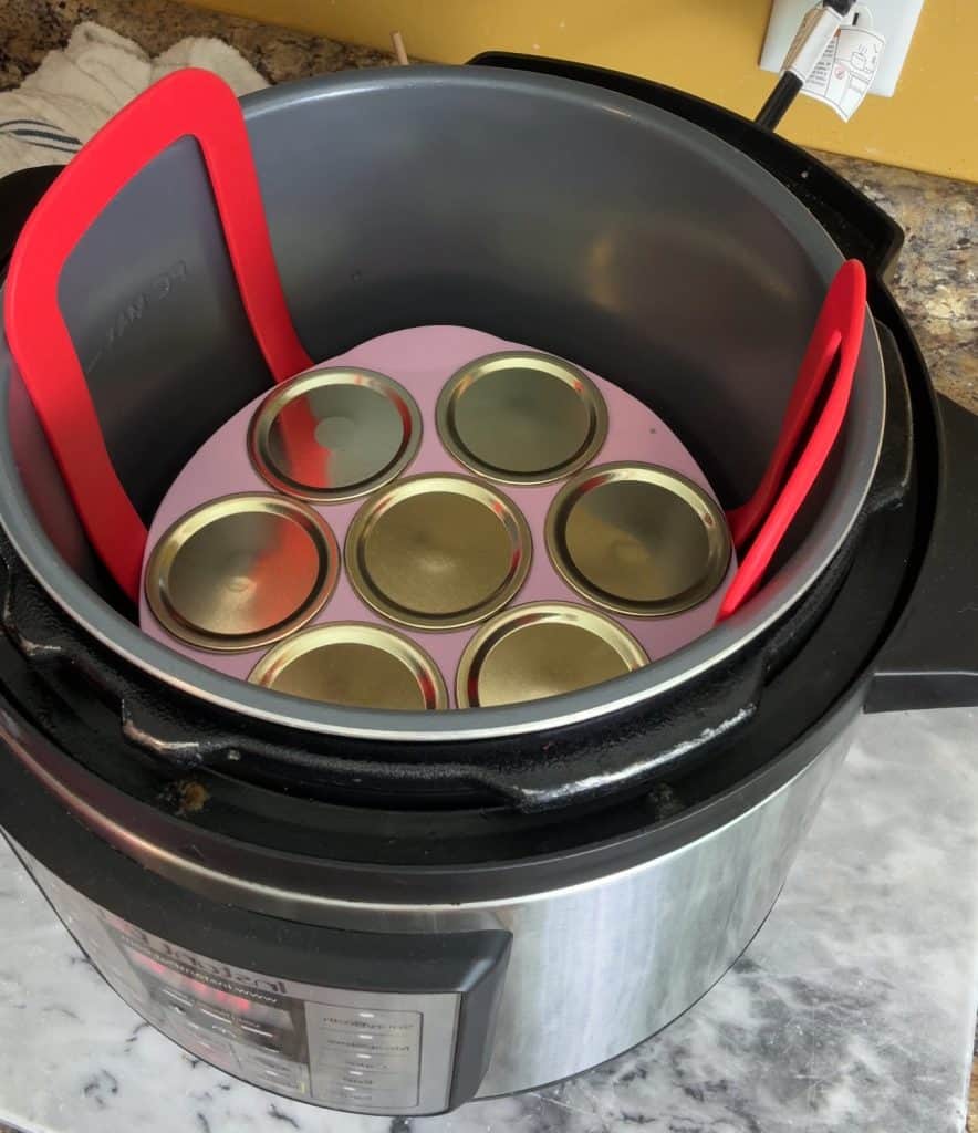 blueberry corn muffins in an instant pot covered by mason jar lids