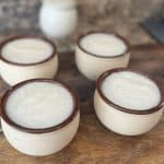 homemade dish soap in thrifted bowls on a wood board