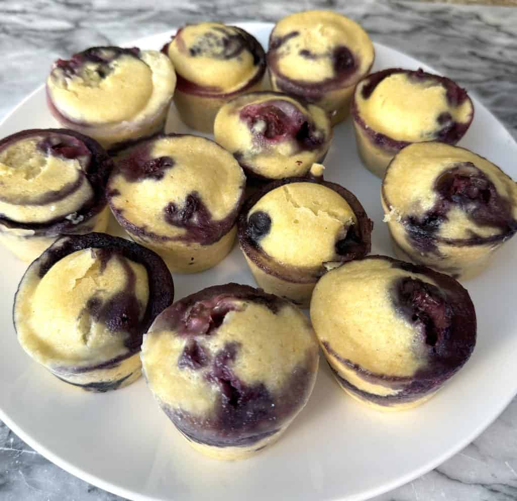Instant Pot Blueberry Corn Muffin Bites sitting on a white plate