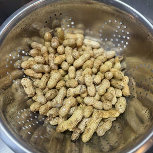 raw peanuts in a colander