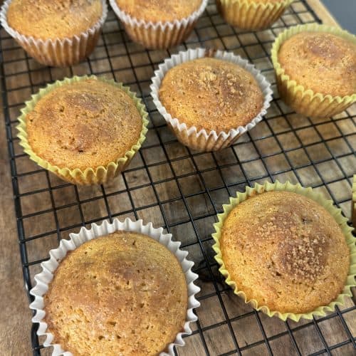 cinnamon raisin muffins cooling on a cooling rack