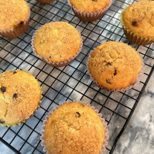 chocolate chip banana muffins cooling on a wire rack