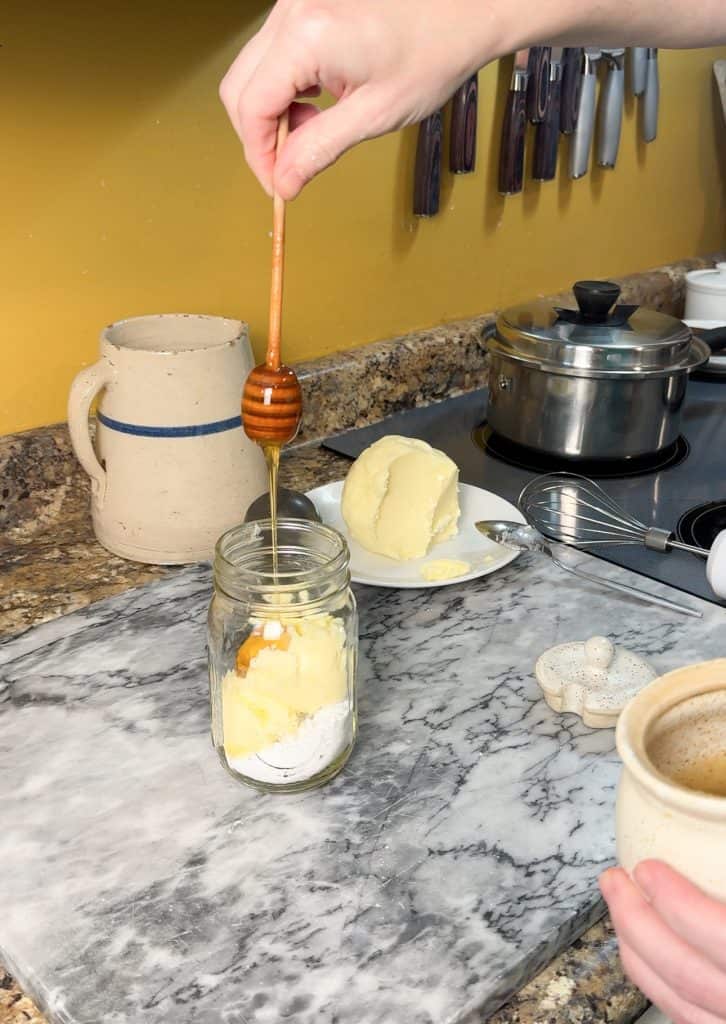 adding honey to the ingredients for cinnamon sugar butter