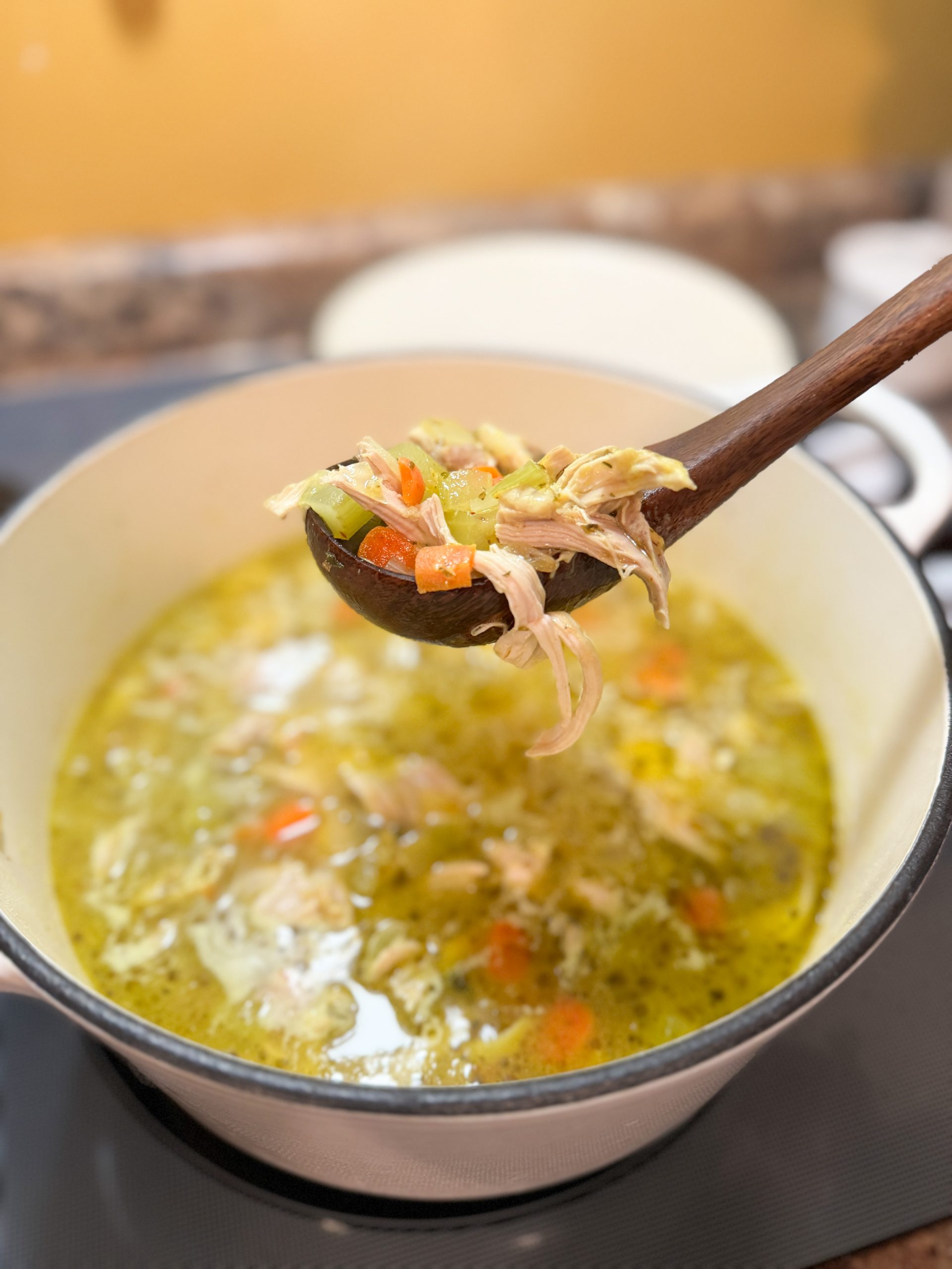 Penicillin Soup. being ladled out of a large dutch oven with a wooden spoon
