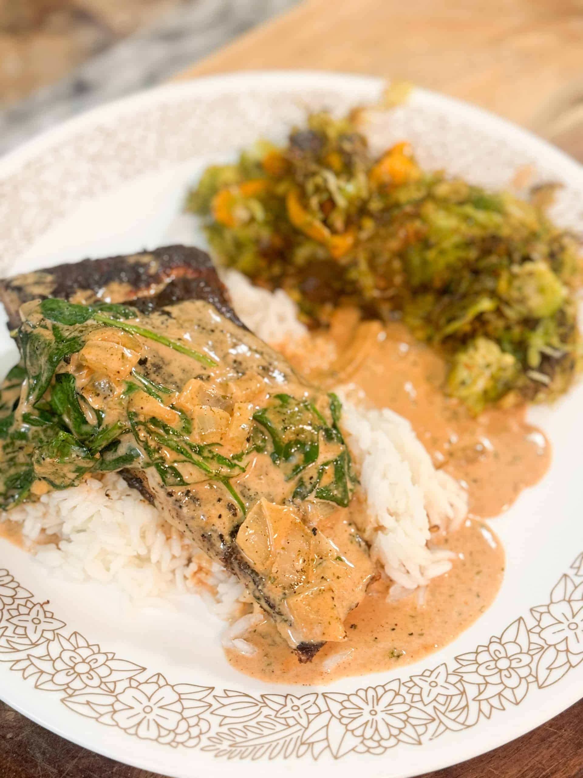 Pan-Seared Steelhead Trout in Creamy Tomato Spinach Sauce