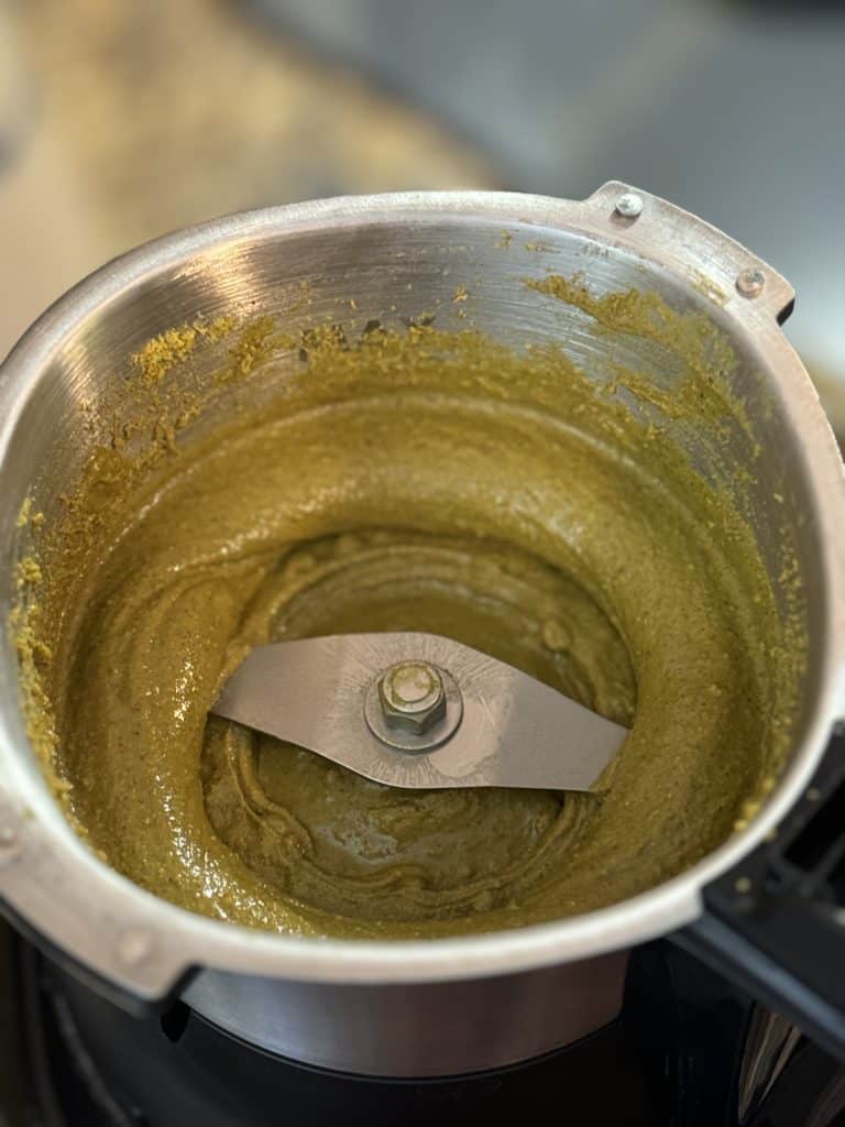 pistachio butter being blended in a food processor