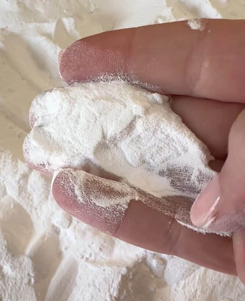 showing the texture of the washing soda against my fingers
