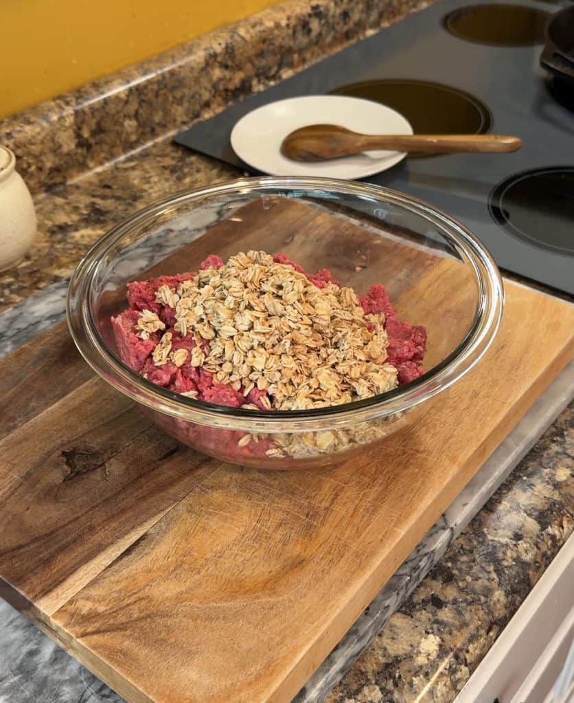 adding old fashioned oats to fresh ground beef