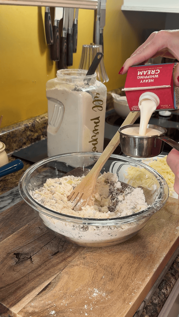 adding heavy cream to scone mixture