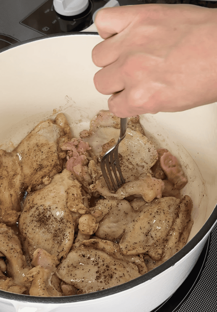 browning chicken thighs in a large dutch oven