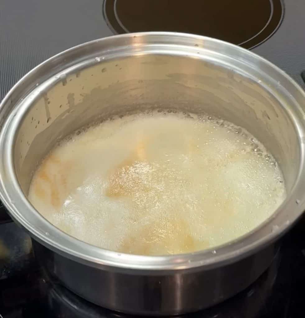 Foaming butter in a stainless steel pot 